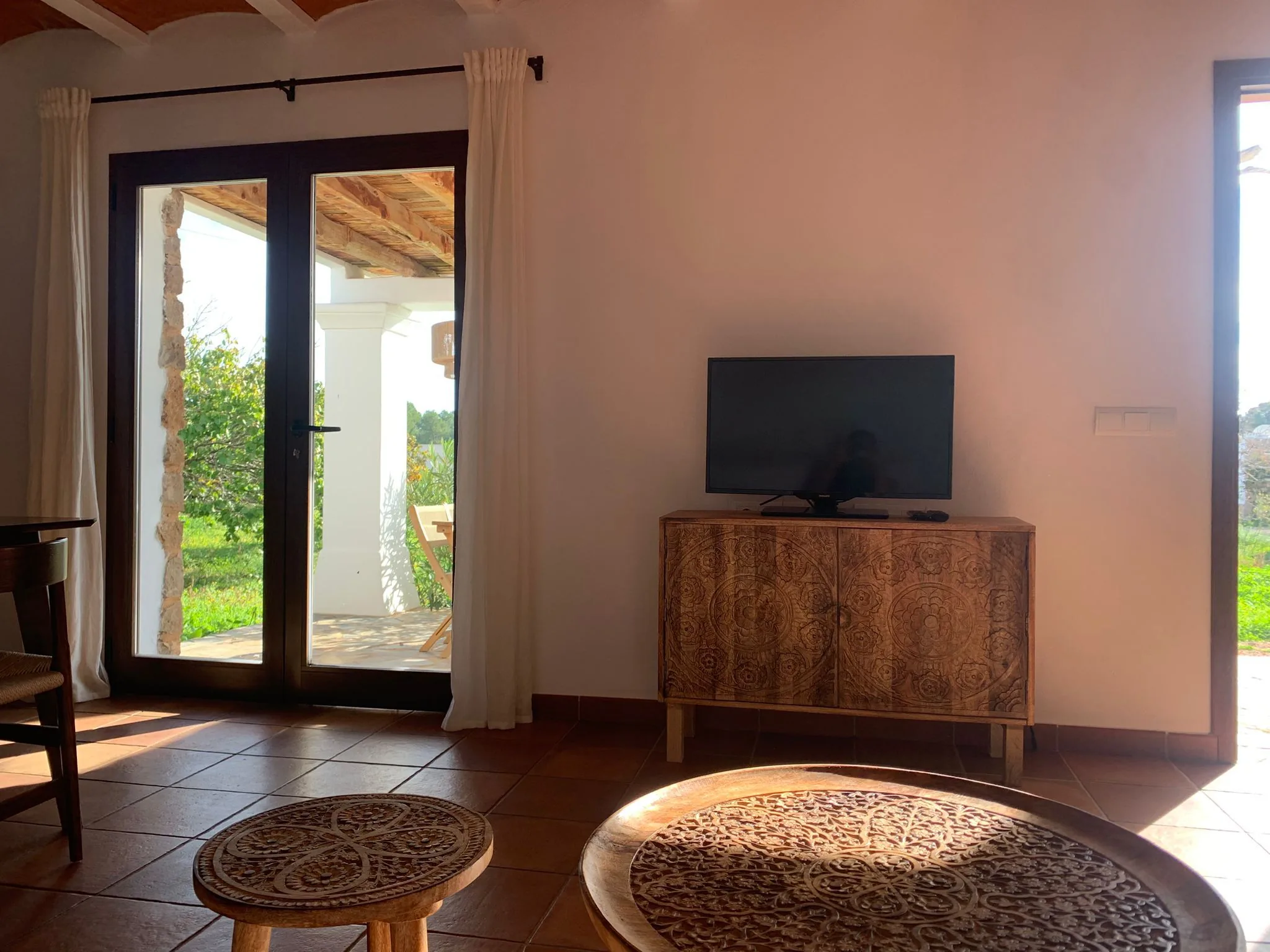Living room with ornate carved wooden cabinet — La Casa de Mis Sueños