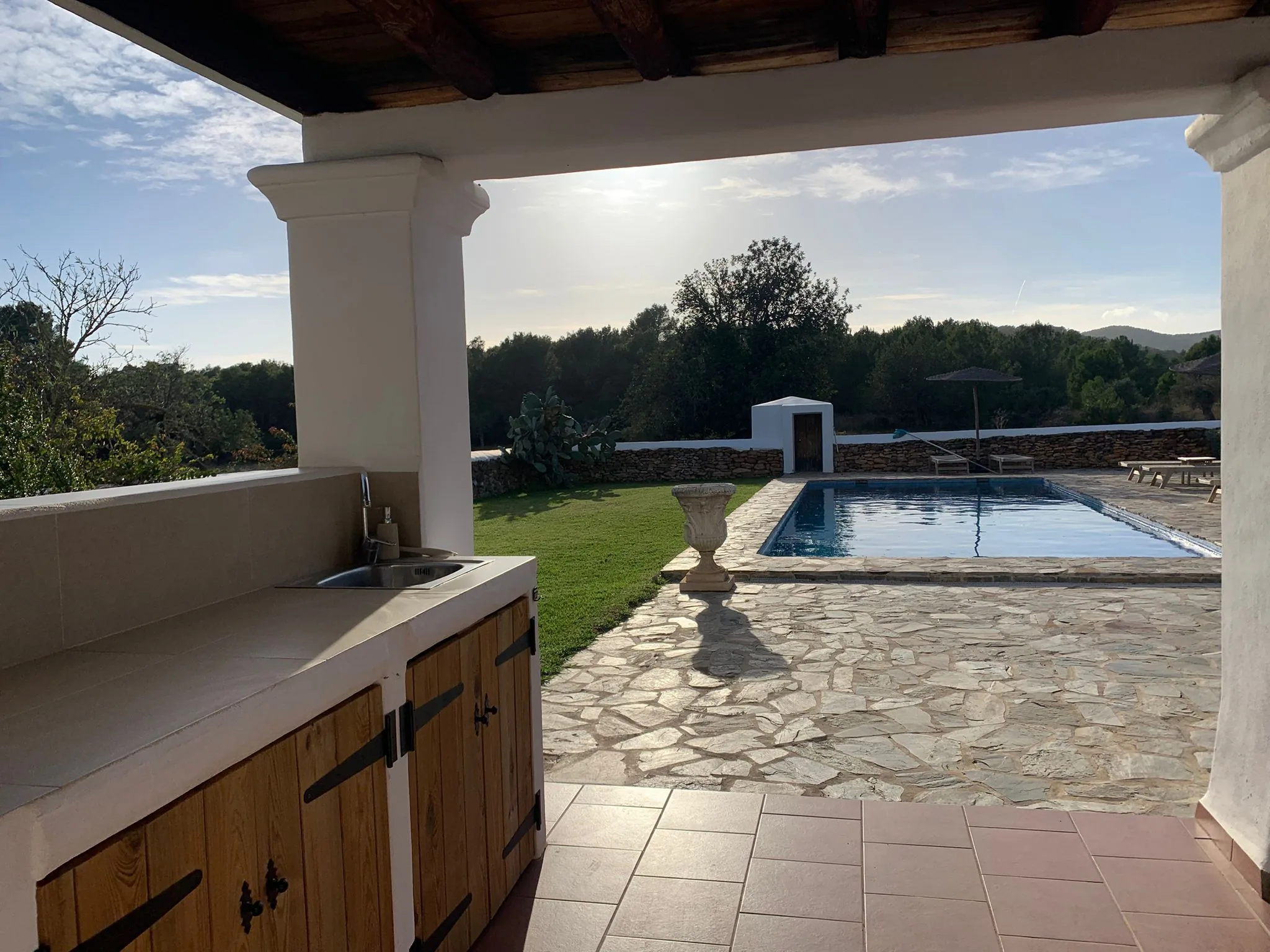 View from the shaded veranda toward the private pool in Ibiza